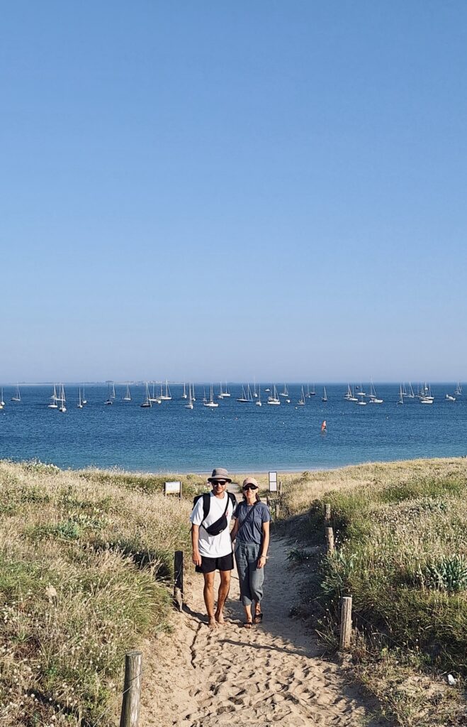 Erica and Stefan in Brittany with sailing boats in the background