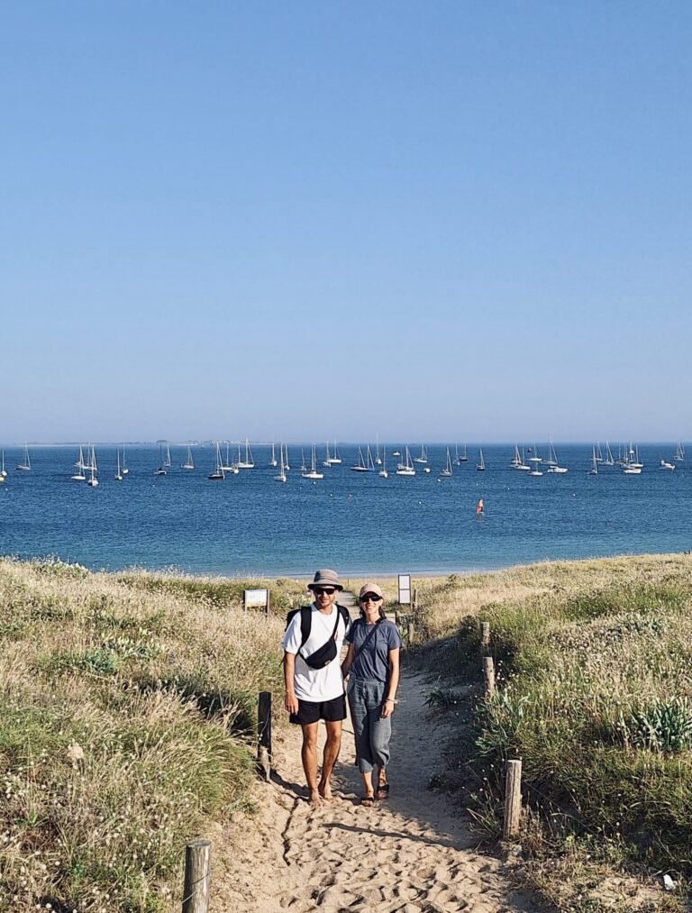 Erica & Stefan in Brittany, sailing boats in the background