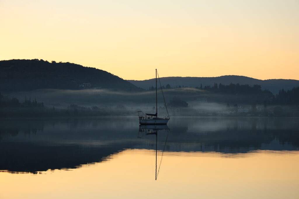 Morning Fog Sunrise Sailboat in Winter, Vliho, Greece